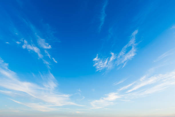 istock beautiful airatmosphere bright blue sunset sky background abstract clear texture with white clouds. 2205805970