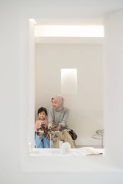 istock Happy Mother and Daughter in Cafe 2205807311