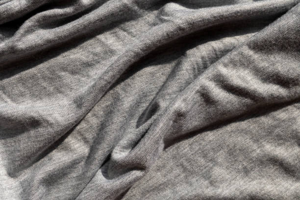 istock Gray knitted fabric close up. Copy space. 2205813238