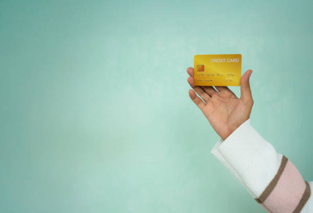 istock Hand holding credit card 2205813276
