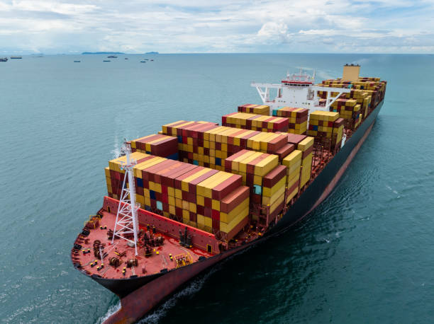 istock cargo logistic container ship sailing in sea import export goods and distributing products to dealer consumers across Asia pacific and worldwide. global business transportation by container ship, front view 2205817140