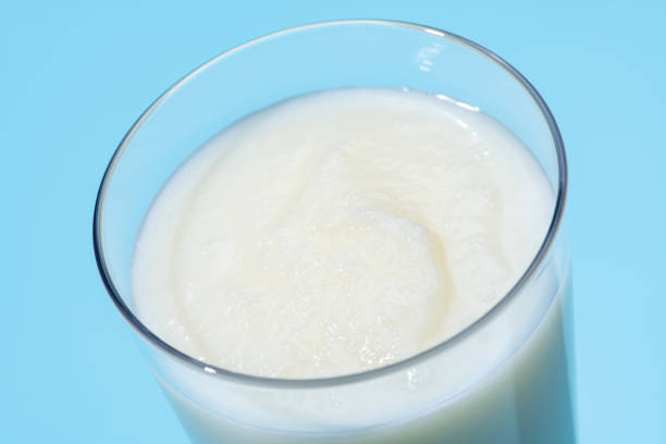 Close-up of a vanilla shake on a light blue background