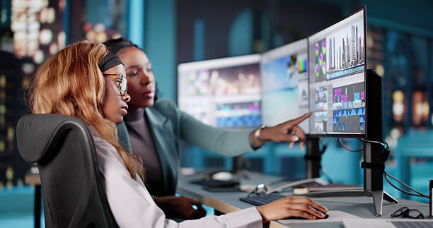 istock Late Night African American Woman Video Editor 2205819100
