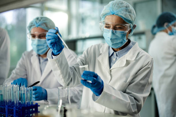 istock Mature scientist working on antiviral drug in laboratory. 2205819929