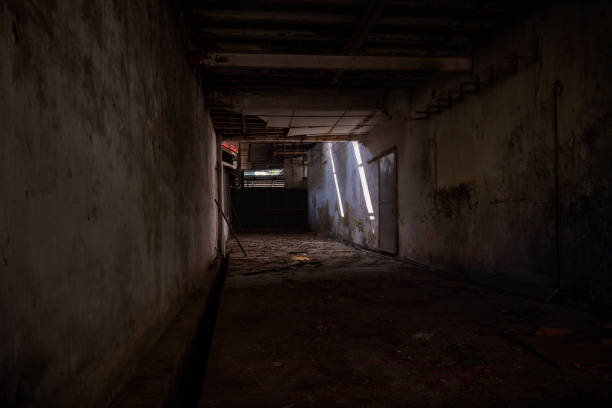 istock Derelict Warehouse with Broken Windows and Worn-Out Walls. Abandoned warehouse. 2205823896