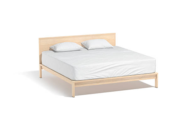 istock Blank wooden double bed with white bedding mockup, half-turned view 2205824267