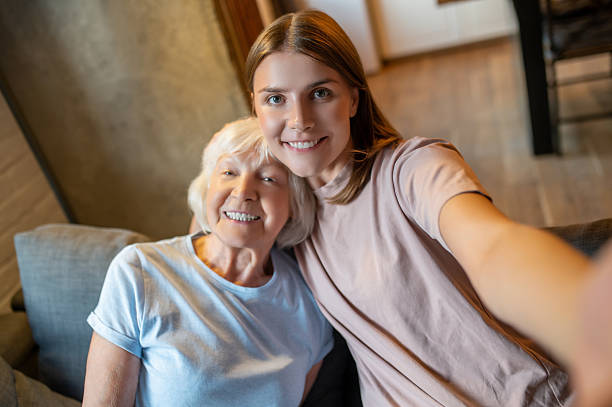 istock Young nurse making selfie with an elderly woman and both feeling happy 2205824749