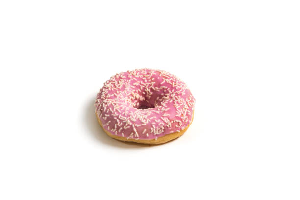 Pink donut isolated on white background.