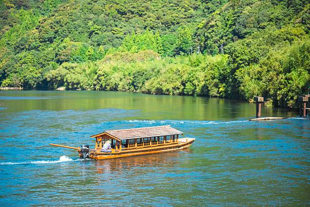 istock Traditional Japanese Boat on a Serene River 2205827250