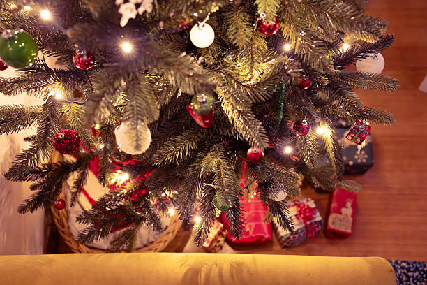 istock Decorated Christmas Tree with Ornaments and Gifts Underneath 2205828973