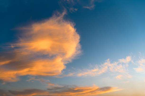 Picturesque orange clouds during sunset. Background