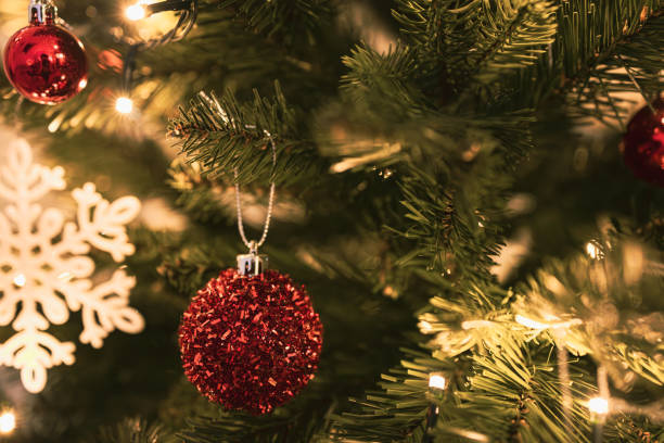 istock Beautifully Decorated Christmas Tree with Red Baubles and Snowflake Ornament 2205829346