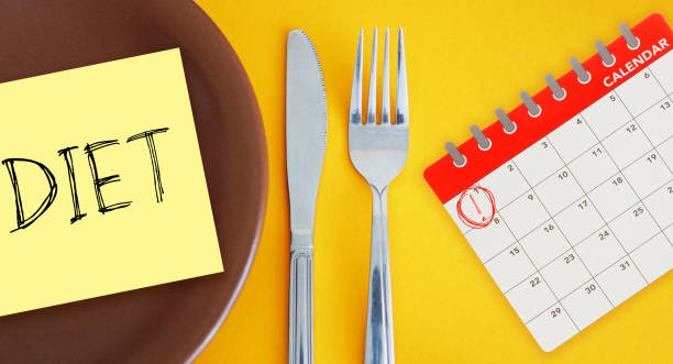 istock Diet Plan Reminder on Calendar. Weight loss and Diet control 2205830453