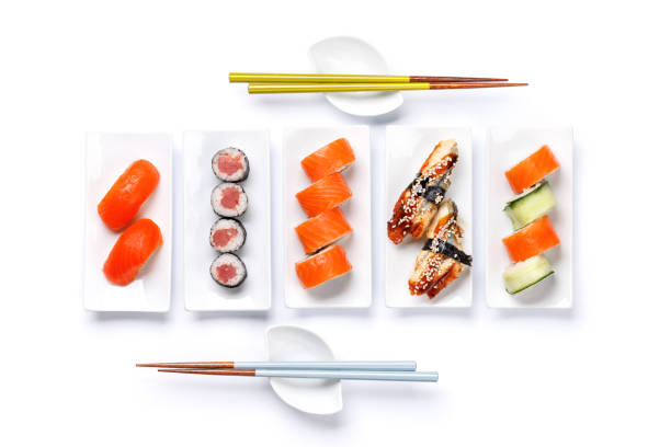 Assorted sushi and maki rolls beautifully arranged on plates