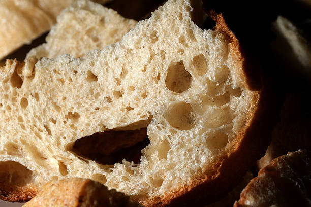 istock Deliciously rustic bread showcasing its airy texture and natural crust 2205834468