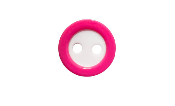istock Pink button with two holes close-up isolated on white background 2205836935