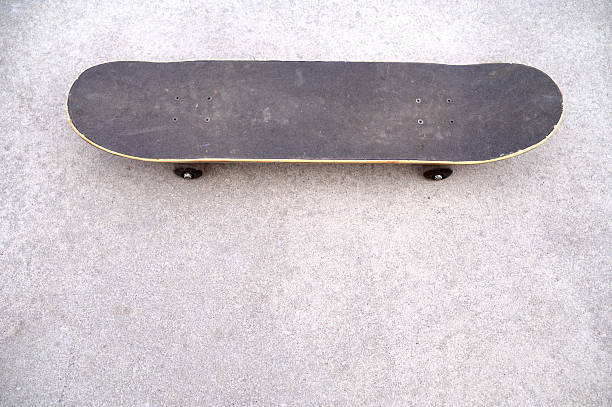 istock A skateboard or a longboard on a pump trek or a pump ramp, copy space 2205837336