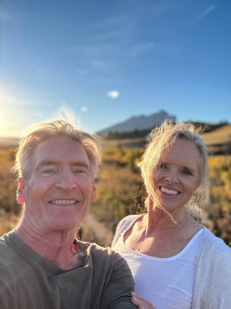 istock Mature couple walking in autumn mountains 2205838145