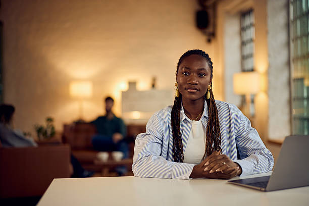 istock Confident Businesswoman Working in a Modern Office Space with Professional Ambience 2205842382