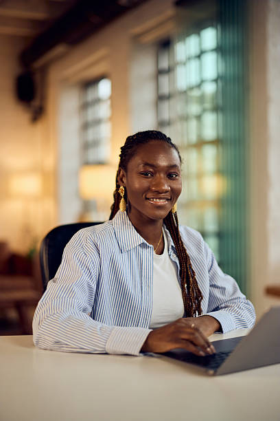 istock Confident Female Professional Sitting at Desk in Modern Workspace 2205842417