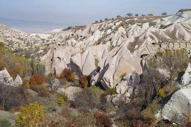 Dwellings carved in stone, in volcanic rock formations eroded by water in the open air museum in Cappadocia, Anatolia, Turkey