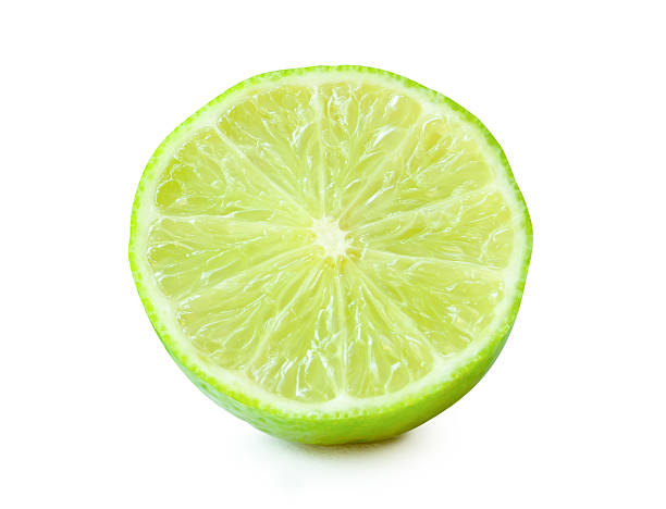 istock Front view of fresh green lemon fruit in half in circle shape without green leaf isolated on white background with clipping path 2205842971
