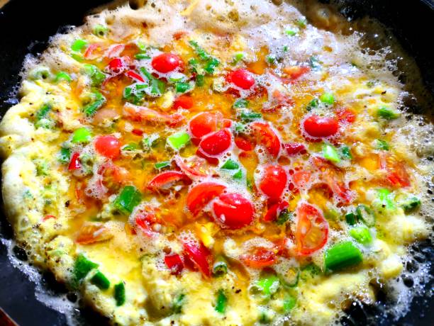 Frying  omelet   in pan
