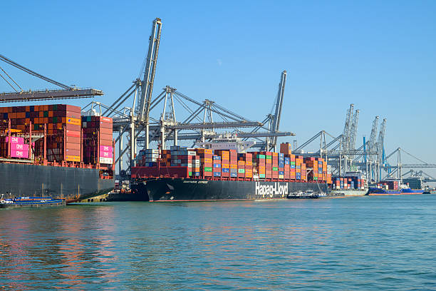 Container ship Guayaquil Express operated by Hapag-Lloyd docked at the container terminal in the port of Rotterdam in The Netherlands during a sunny day at the Maasvlakte close to the North Sea.