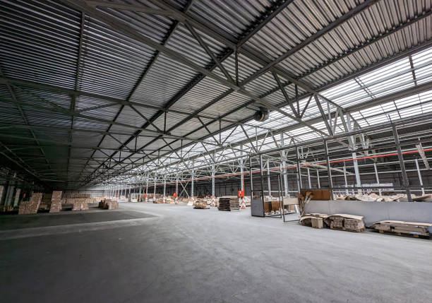 istock interior of a large industrial warehouse 2205849734
