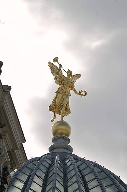istock Golden angel statue on domed building in Dresden. 2205849895