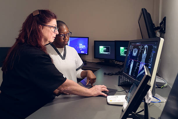 istock Multiracial Female Healthcare professionals analyzing medical imaging data on computer monitors together 2205851089