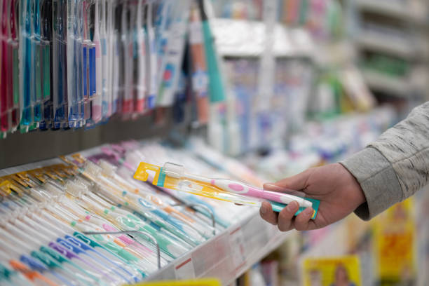istock Shopper's hands choosing a toothbrush 2205851683