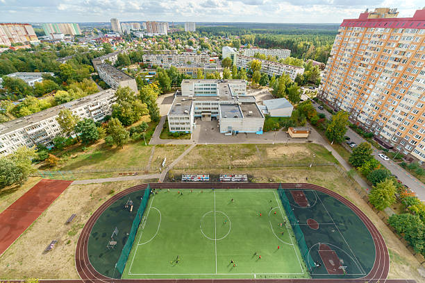 istock A soccer field with a group of people playing on it. 2205857271