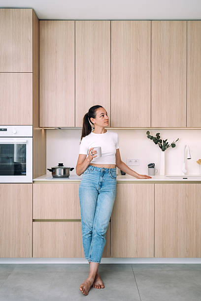 istock Bright and airy wooden kitchen in a modern apartment with a relaxed atmosphere 2205860489