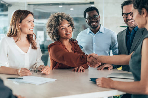 istock Shaking hands with new colleague 2205864172