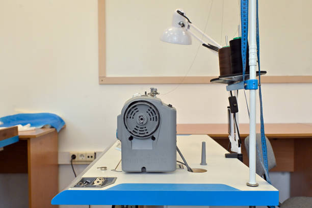 The studio cuts fabrics and sews clothes of different shapes and colors