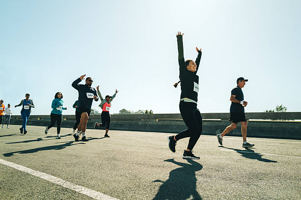 istock Group of runners celebrating achievement during a race 2205864687