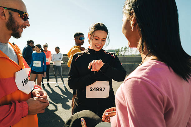istock Runners gather at the marathon starting line under clear skies 2205864755
