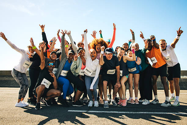 istock Group of diverse runners celebrating after a community event 2205865100