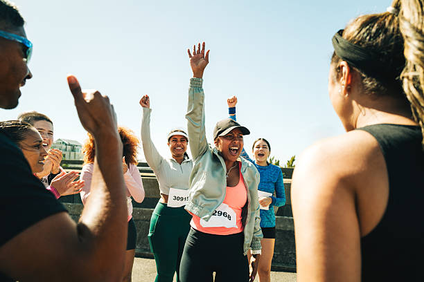 istock Group of friends cheering after completing a marathon together 2205865970