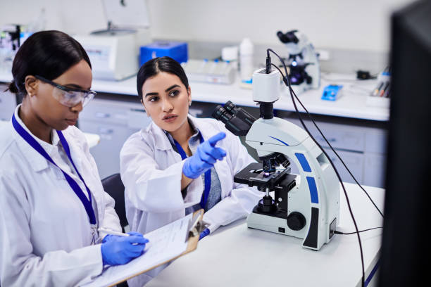 istock Two young female scientists working together to find a cure 2205868273