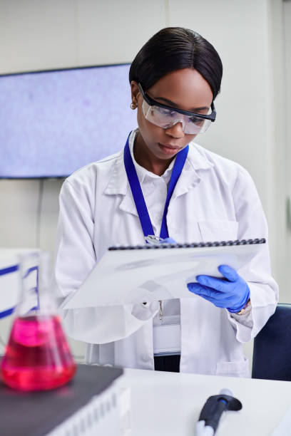 istock A young female scientist writing notes in a clean biochemistry laboratory 2205869132