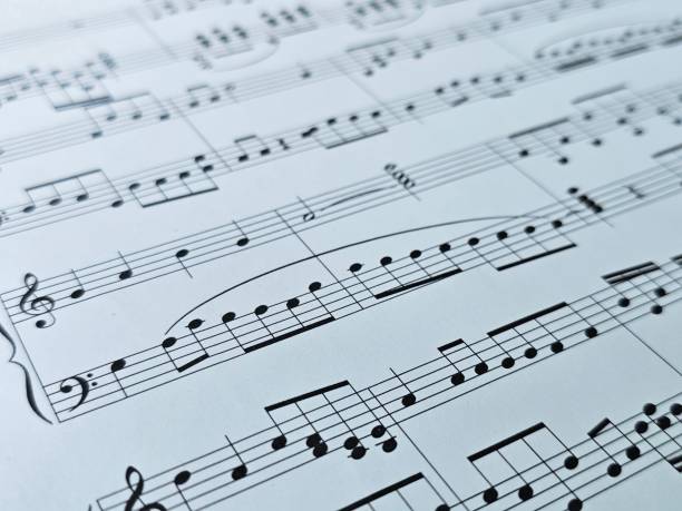 istock Sheet music featuring intricate musical notation on a white background, displaying various notes and clefs for composition and study concept 2205869818
