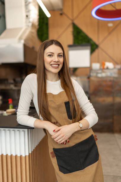 istock Confident female barista in a cafeteria 2205873908