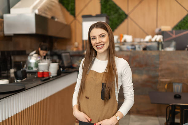 istock Confident female barista in a cafeteria 2205874100