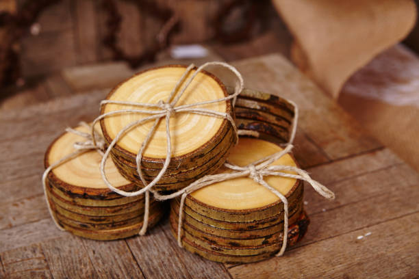 istock Rustic Wooden Disc Coasters with Twine on Burlap Background 2205876512