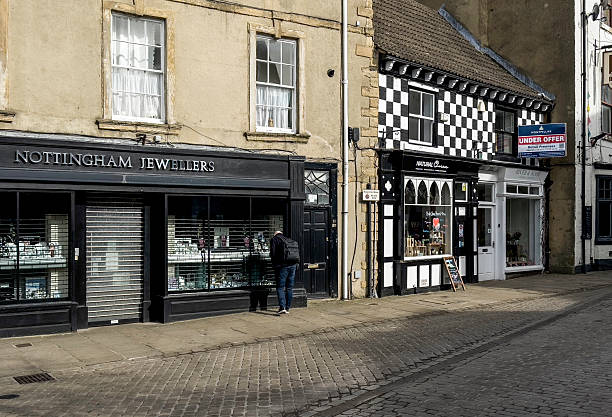 View of Knaresborough town centre, North Yorkshire, UK. A man can be seen looking into a shop window