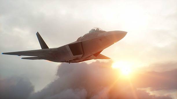 istock Military fighter jet F-22 flying over clouds. Air force. 3d rendering. 2205877024
