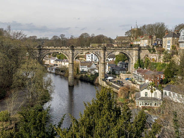 View of Knaresborough Viaduct over the River Nidd in North Yorkshire, UK.  People an be seen on the promenade