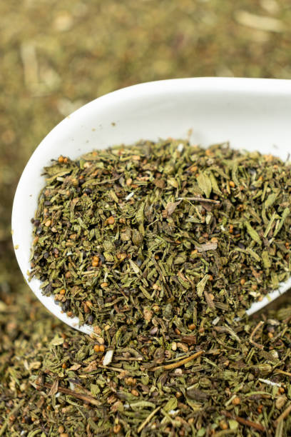 istock Savory herb seasoning in a spoon macro 2205878854